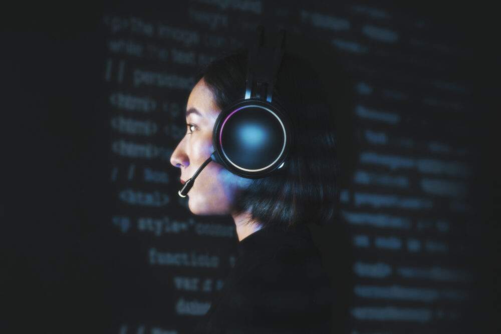Female hacker cracking the binary code